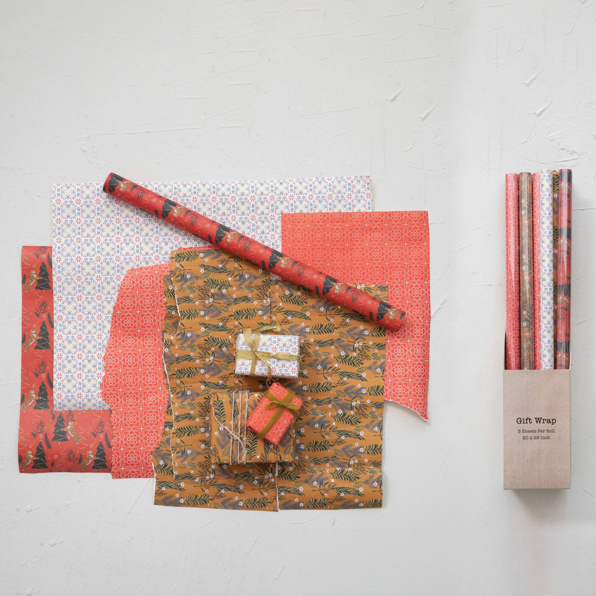Hello Honey® 28" Wrapping Paper Sheets with Various Holiday Patterns, 12ct.